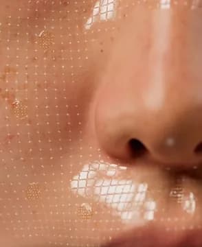 Macro close up of hydrated skin across the nose and cheek